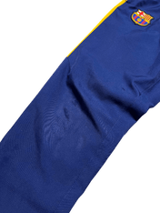 Kék és sárga vintage streetwear melegítőnadrág, címerrel díszítve.