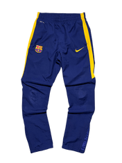 Kék-sárga vintage Nike Barcelona melegítőnadrág, streetwear stílus, logókkal díszítve.